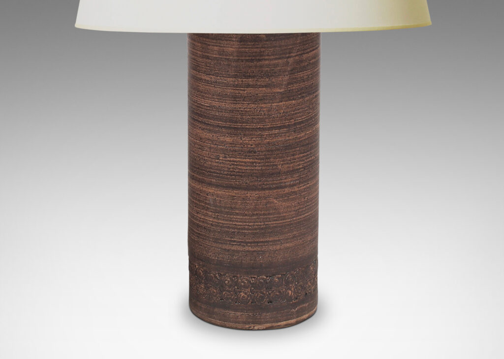 Gallery BAC column forms with bands of rosette motifs in relief and handsome striae faux-bois matte brown