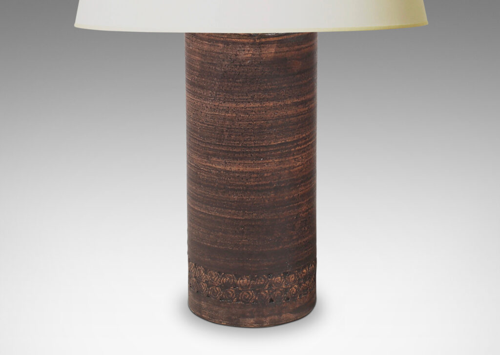 Gallery BAC column forms with bands of rosette motifs in relief and handsome striae faux-bois matte brown