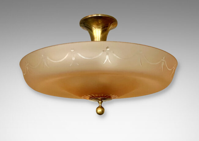 Gallery BAC undulating diffuser in sand-blasted apricot glass with cut swag and rosette pattern and a bronze canopy and mount