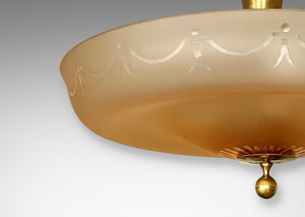 Gallery BAC undulating diffuser in sand-blasted apricot glass with cut swag and rosette pattern and a bronze canopy and mount