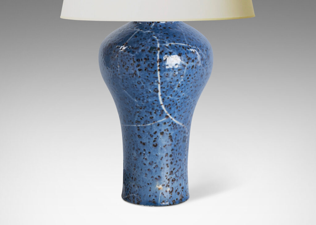 Gallery BAC tall swelling form glazed in a magnificent cornflower blue with black mottling and white streaks