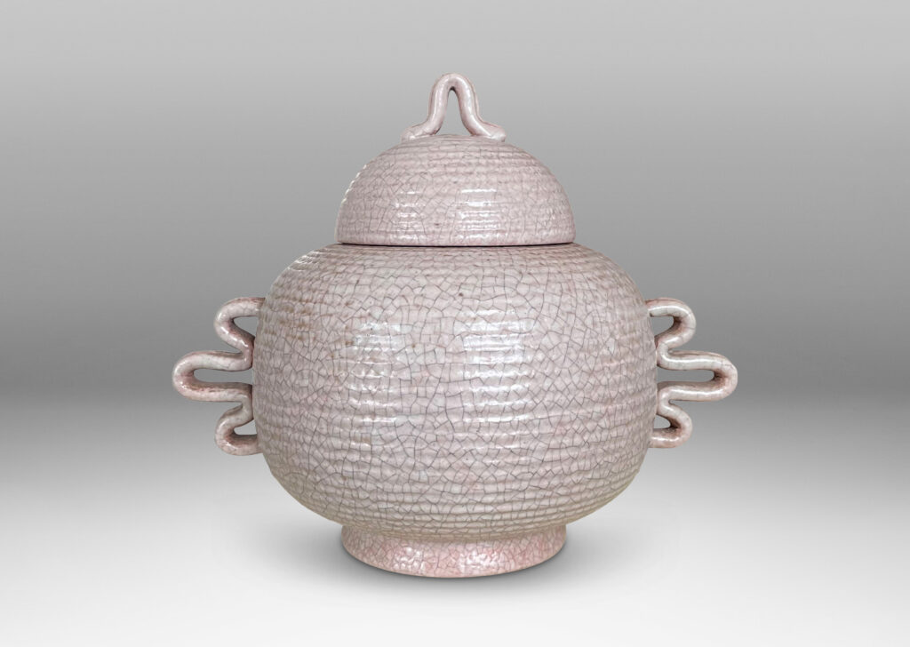 Gallery BAC wide ridged form and dome lid with expressive handles and finial; hand-thrown earthenware with a gray-pale rose craquel glaze