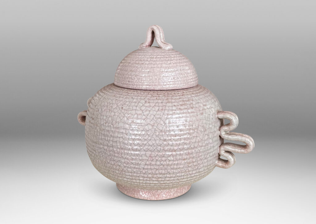 Gallery BAC wide ridged form and dome lid with expressive handles and finial; hand-thrown earthenware with a gray-pale rose craquel glaze