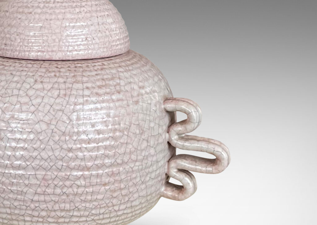 Gallery BAC wide ridged form and dome lid with expressive handles and finial; hand-thrown earthenware with a gray-pale rose craquel glaze