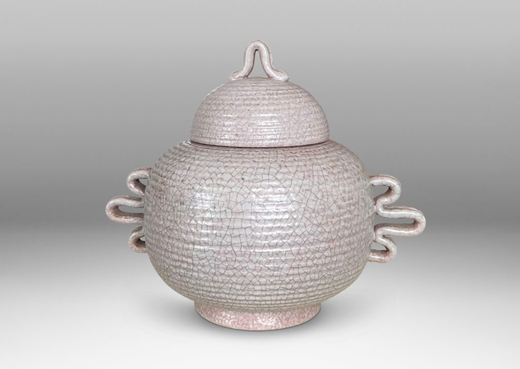 Gallery BAC wide ridged form and dome lid with expressive handles and finial; hand-thrown earthenware with a gray-pale rose craquel glaze