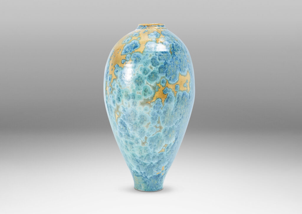 Gallery BAC tapering form glazed in a magnificent gold and cerulean crystalline glaze