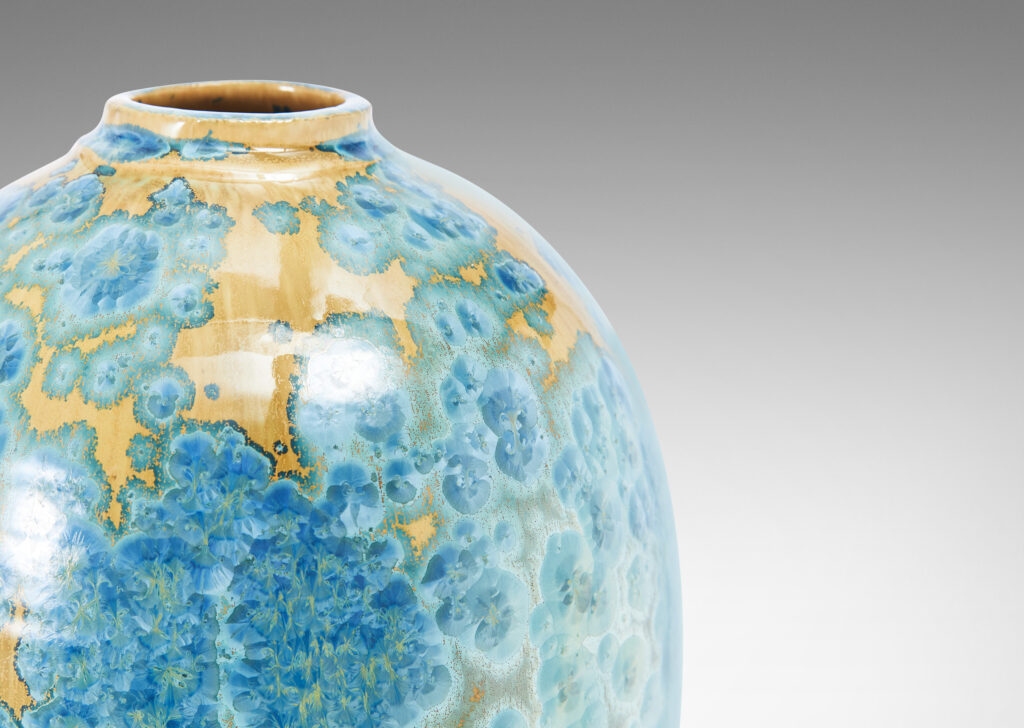 Gallery BAC tapering form glazed in a magnificent gold and cerulean crystalline glaze