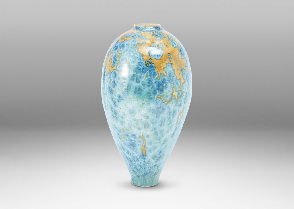 Gallery BAC tapering form glazed in a magnificent gold and cerulean crystalline glaze