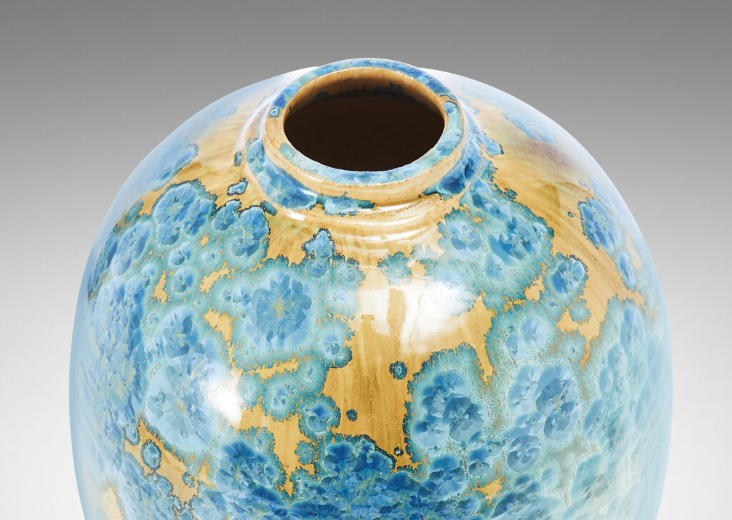 Gallery BAC tapering form glazed in a magnificent gold and cerulean crystalline glaze