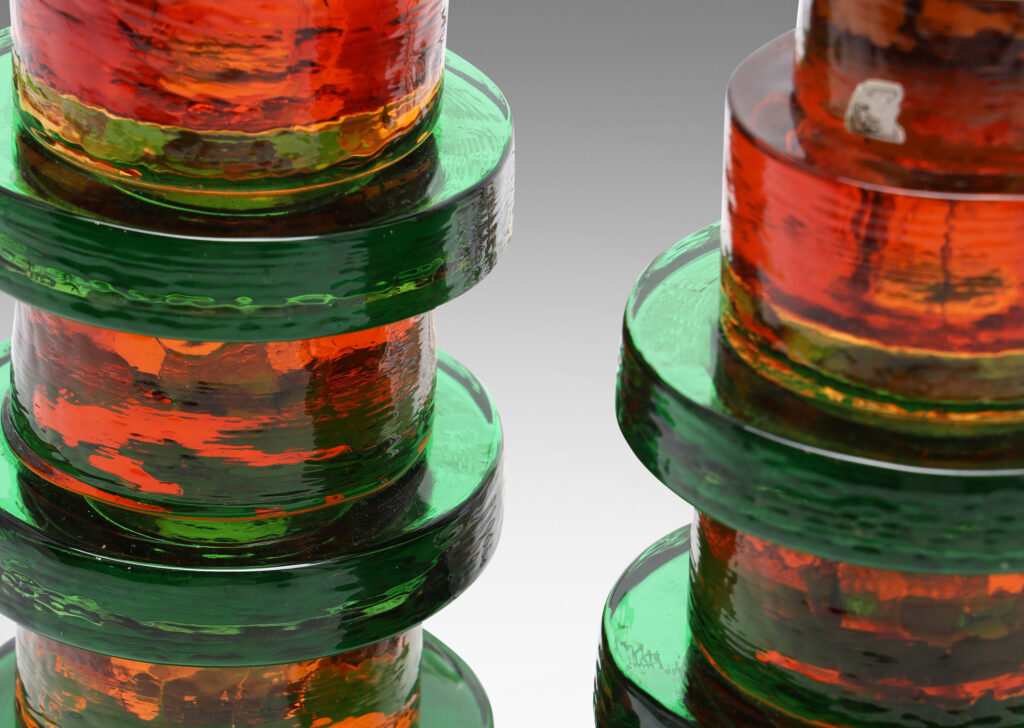 Gallery BAC bases comprised of alternating size disks in green and orange glass