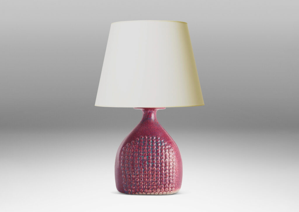 Gallery BAC bottle form with knob texture on front and back and a magnificent mottled raspberry glaze