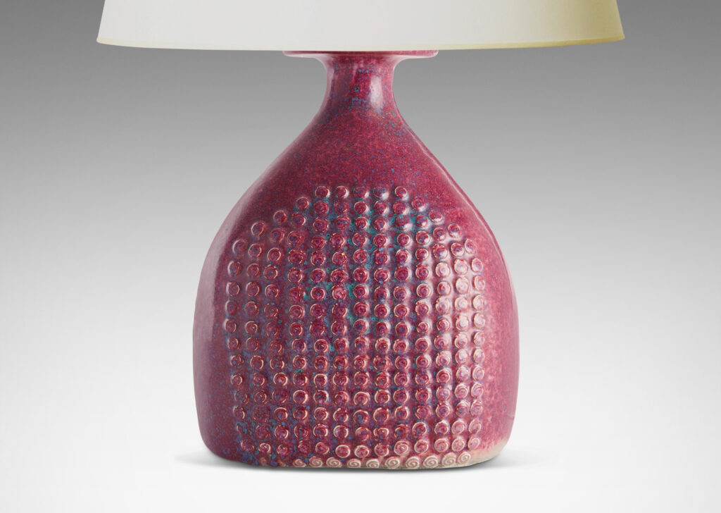 Gallery BAC bottle form with knob texture on front and back and a magnificent mottled raspberry glaze