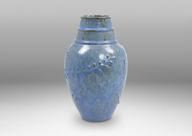 Gallery BAC swelling form with botanical reliefs in earthenware with a dappled gray-cerulean