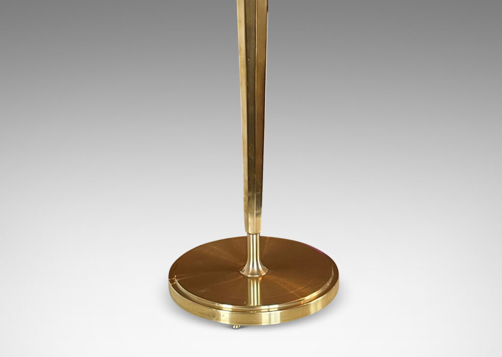 Gallery BAC tapered and octagonally faceted stand on a disk plinth with a shallow dome shade in brass