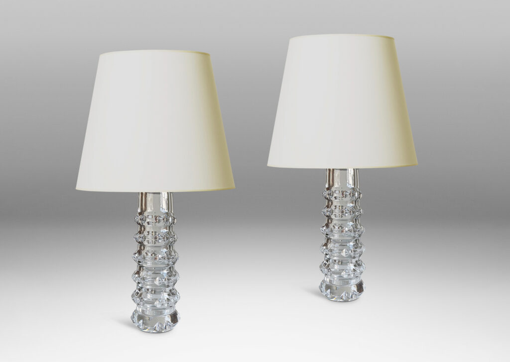 Gallery BAC cylindrical bases punctuated with notched raised bands to catch the light, crafted in cut crystal