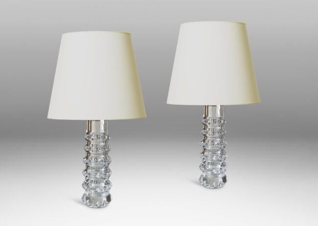 Gallery BAC cylindrical bases punctuated with notched raised bands to catch the light, crafted in cut crystal