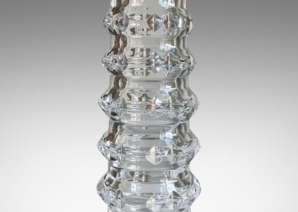 Gallery BAC cylindrical bases punctuated with notched raised bands to catch the light, crafted in cut crystal