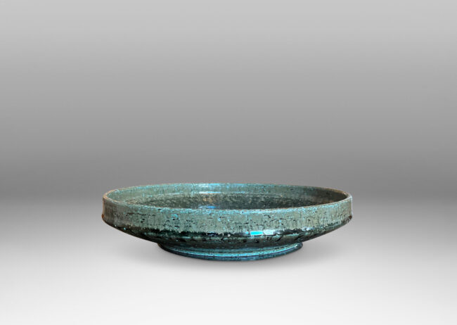 Gallery BAC wide concave form with low straight sides and a reveal foot; in grog stoneware with an olive green-gray glaze