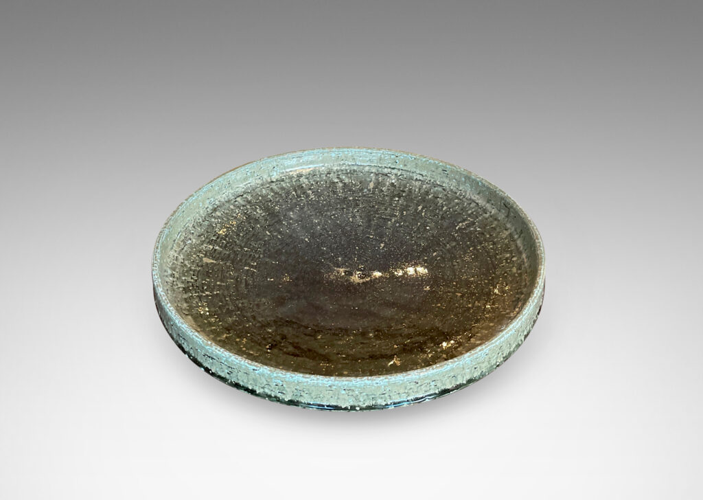 Gallery BAC wide concave form with low straight sides and a reveal foot; in grog stoneware with an olive green-gray glaze