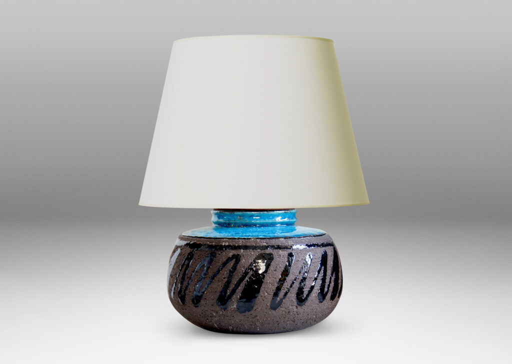 Gallery BAC round bun forms in brown with a tonal design and a vibrant azure blue cap