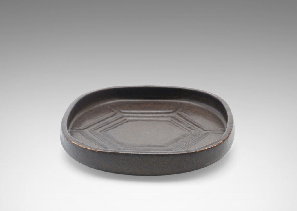 Gallary BAC rounded square form with low edges and carved hexagonal pattern in a deep ganache brown