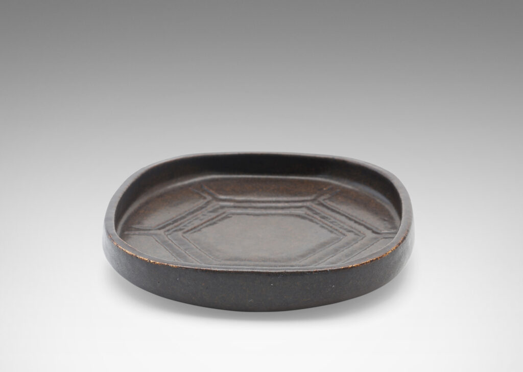 Gallary BAC rounded square form with low edges and carved hexagonal pattern in a deep ganache brown