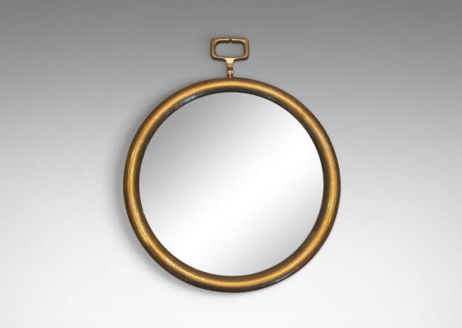 Gallery BAC round frame with rectangular loop on top in the manner of a pocket watch; brass, mirrored glass