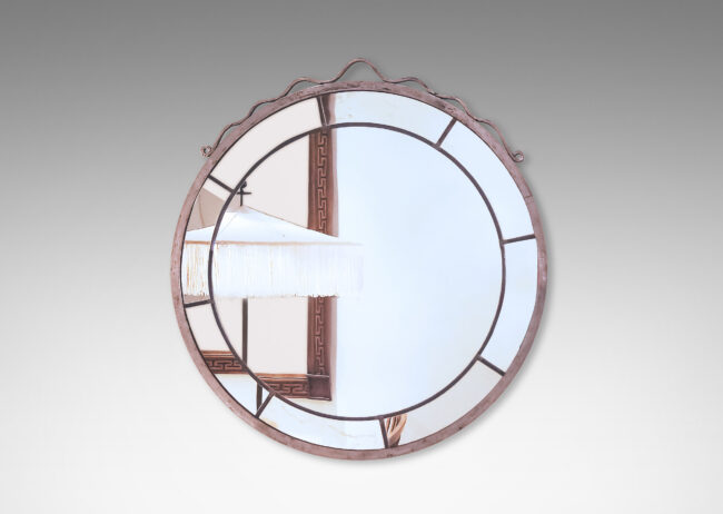 Gallery BAC central round panel framed in arc-shaped sections, set in a metal frame given a worked texture, crowned with a ribbon-like looped pediment