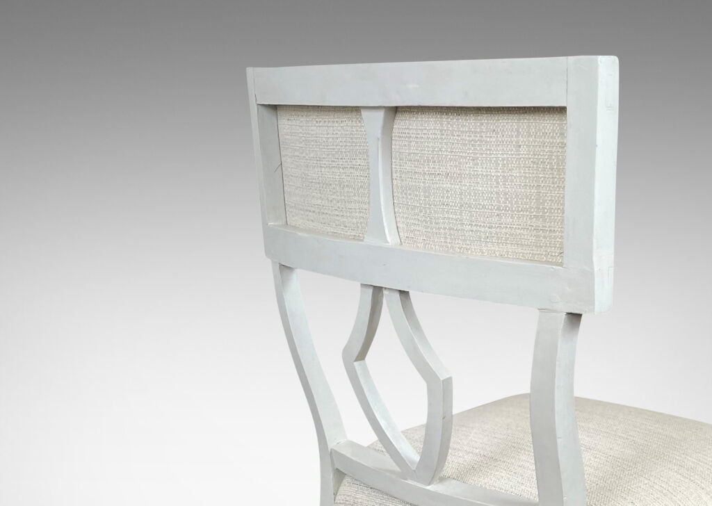 Gallery BAC upholstered klismos style back rails and shield/lyre form black splats, turned front legs and sabered back legs, meticulously crafted in white-washed birch