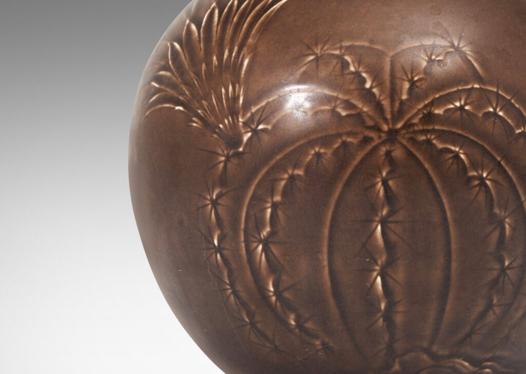 Gallery BAC spherical form with tall tapered neck and carved relief depicting cacti in a deep chocolate brown