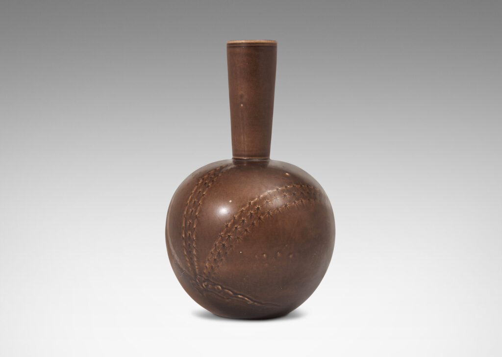 Gallery BAC spherical form with tall tapered neck and carved relief depicting cacti in a deep chocolate brown