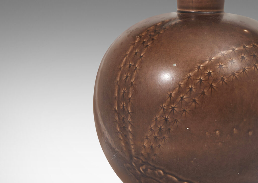 Gallery BAC spherical form with tall tapered neck and carved relief depicting cacti in a deep chocolate brown