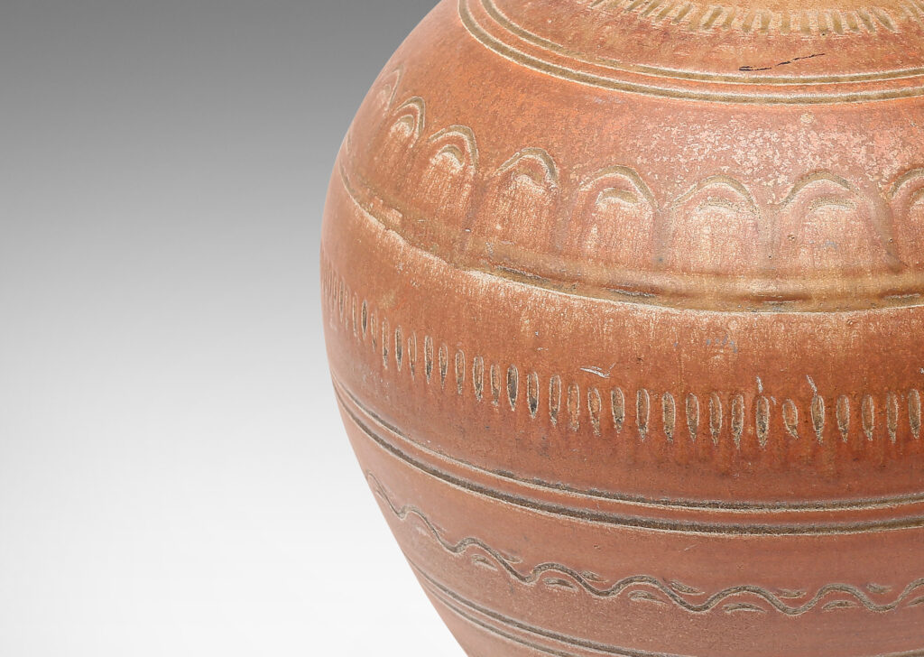 Gallery BAC large tapering globe form with outstretching mouth and surrounded in rings of carved geometric ornaments