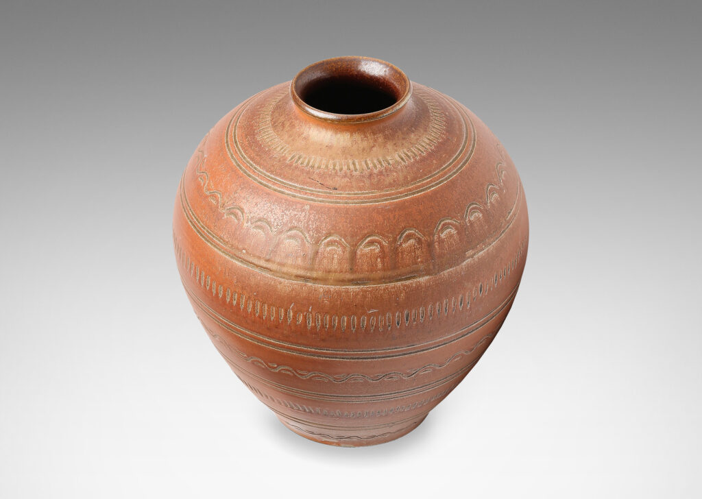 Gallery BAC large tapering globe form with outstretching mouth and surrounded in rings of carved geometric ornaments