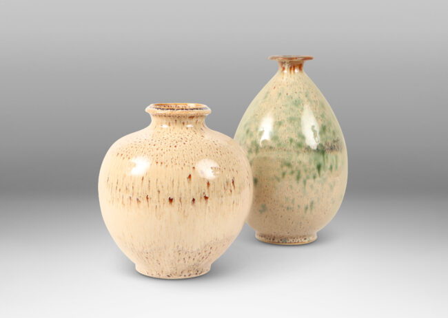 Gallery BAC one a globe in form, the other more of an ovoid, both in wonderful flowing cream and burnt sienna glaze