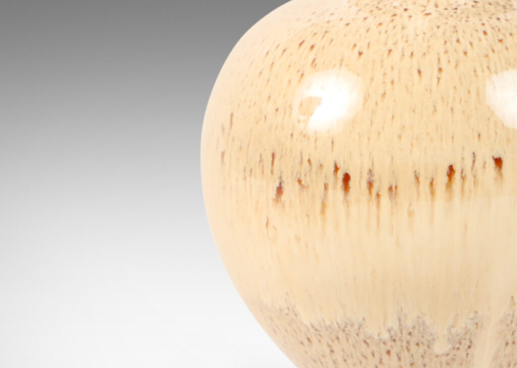 Gallery BAC one a globe in form, the other more of an ovoid, both in wonderful flowing cream and burnt sienna glaze