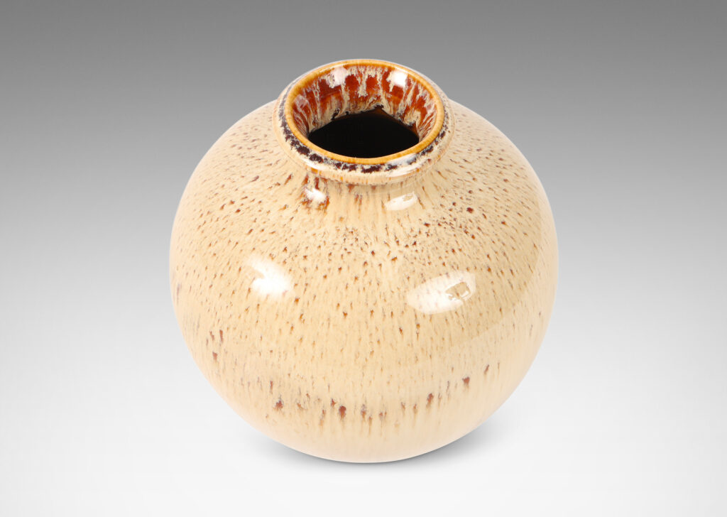 Gallery BAC one a globe in form, the other more of an ovoid, both in wonderful flowing cream and burnt sienna glaze