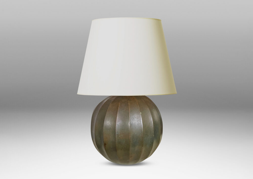 Gallery BAC vertically fluted globe form in cast stone finished in the manner of bronze