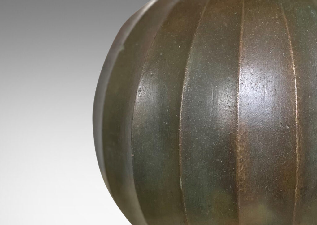 Gallery BAC vertically fluted globe form in cast stone finished in the manner of bronze