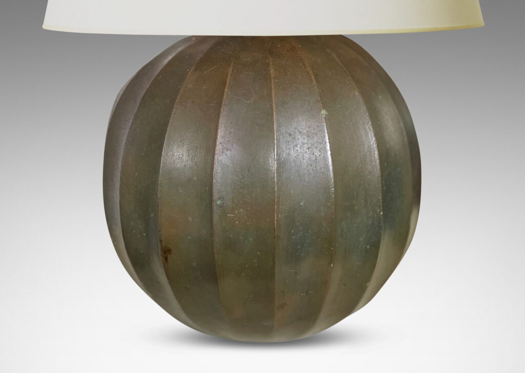 Gallery BAC vertically fluted globe form in cast stone finished in the manner of bronze