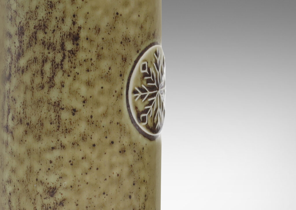 Gallery BAC round column forms with snowflake medallions in taupe with brown dappling