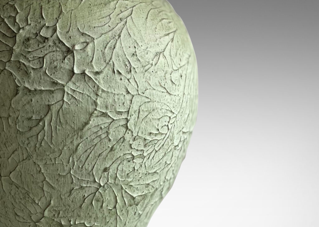 Gallery BAC balloon-like forms on disk plinths with wonderfully textured surfaces in a matte pale celadon green