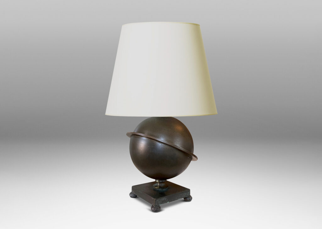 Gallery BAC Saturn-ringed globe form on a square footed base; patinated bronze