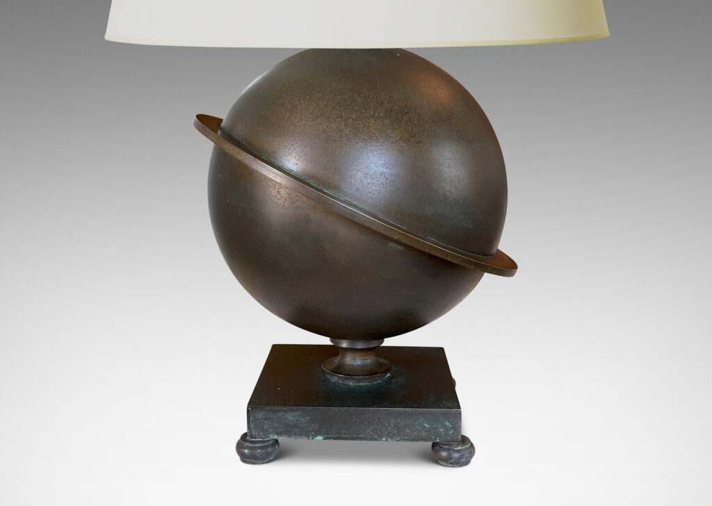 Gallery BAC Saturn-ringed globe form on a square footed base; patinated bronze