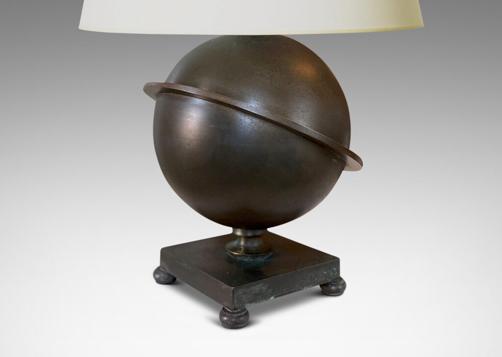 Gallery BAC Saturn-ringed globe form on a square footed base; patinated bronze