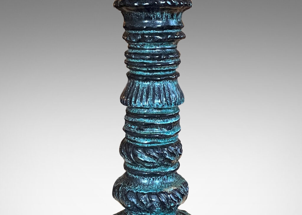 Gallery BAC textured tassel form in teal-black glaze; hand-sculpted earthenware