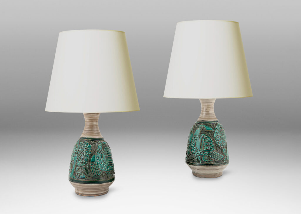 Gallery BAC angled decanter-like forms with carved reliefs depicting birds and trees, in shiny saturated jade green and matte striae pale taupe