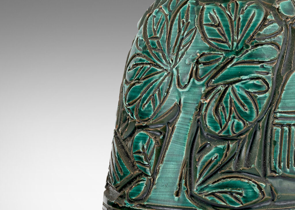 Gallery BAC angled decanter-like forms with carved reliefs depicting birds and trees, in shiny saturated jade green and matte striae pale taupe