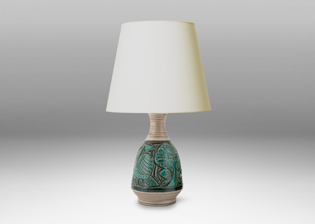 Gallery BAC angled decanter-like forms with carved reliefs depicting birds and trees, in shiny saturated jade green and matte striae pale taupe