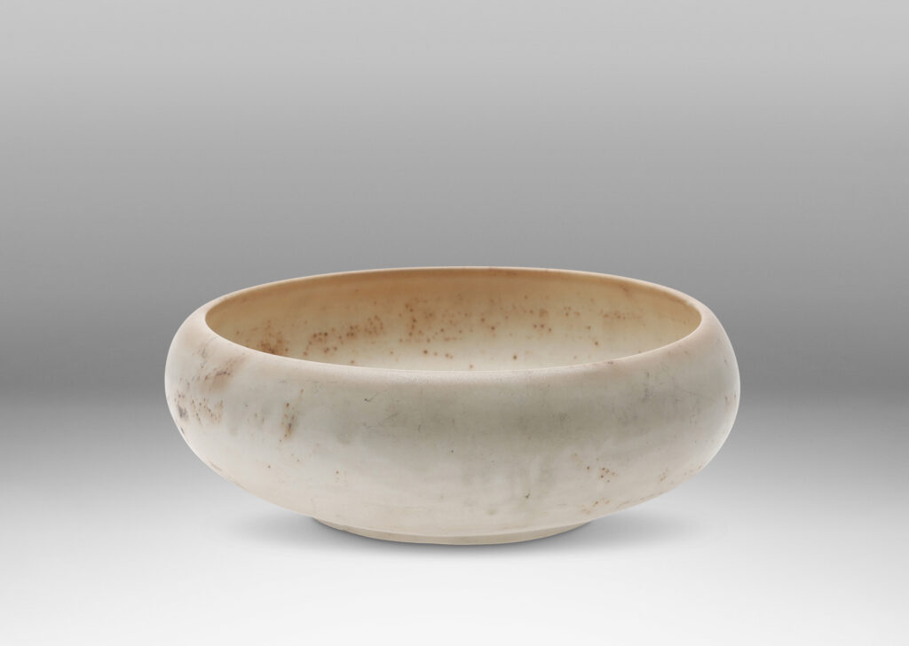 Gallery BAC considered organically modeled form in ivory with buff tones and brown speckling